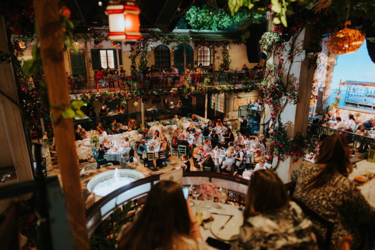 Guests dining at Nikos taverna at Mamma Mia The Party