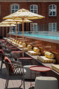 Sunlit courtyard pool at Villa Copenhagen, a Strawberry hotel