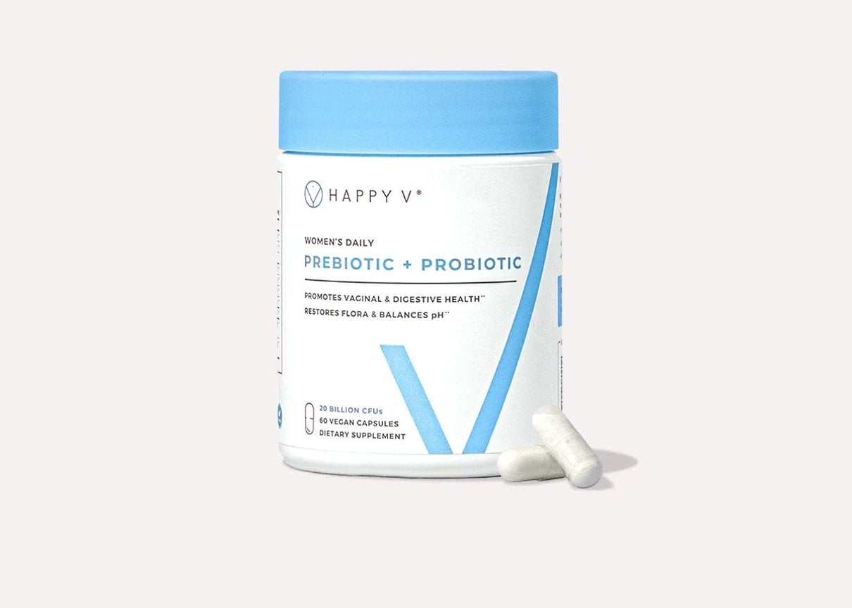 Happy V Prebiotic and Probiotic supplement bottle on a neutral background