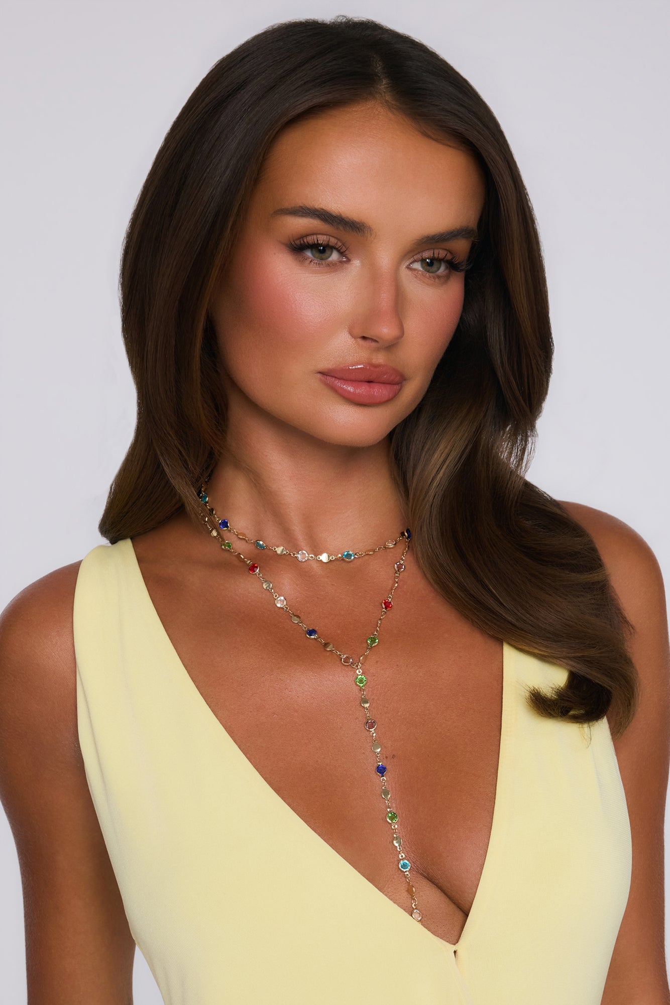 Model wearing a yellow dress in a styled fashion look