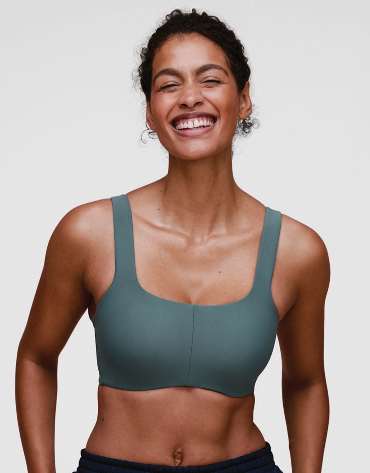 Teal Move 360 sports bra shown from the front