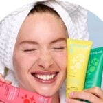 Woman holding Cocofloss oral care products