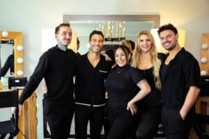 Glamsquad beauty professionals standing together at an event glam suite