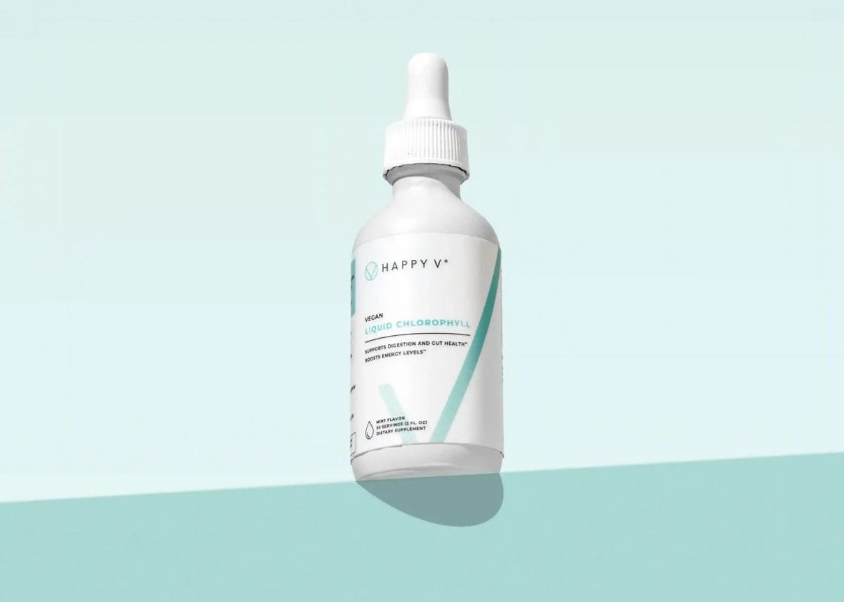 Happy V Liquid Chlorophyll bottle on a colored background