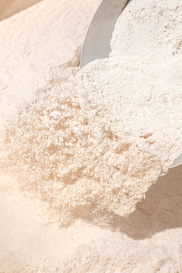 Supplement powder and scoop on a preparation surface