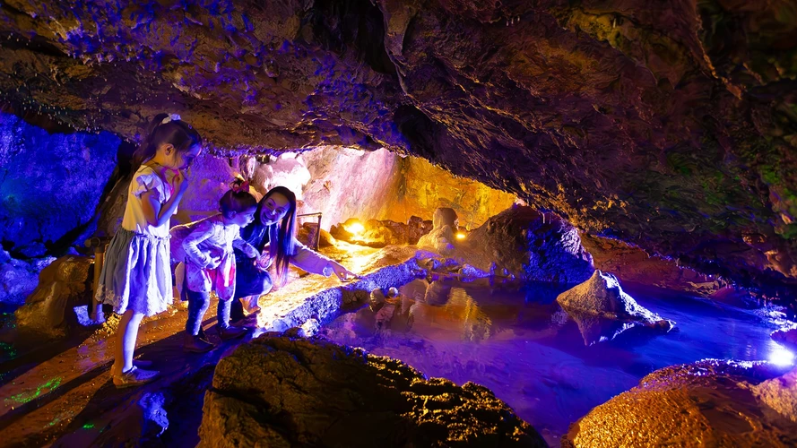 Visitors exploring a cave attraction