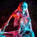 Illuminated skeleton decoration at a Halloween attraction