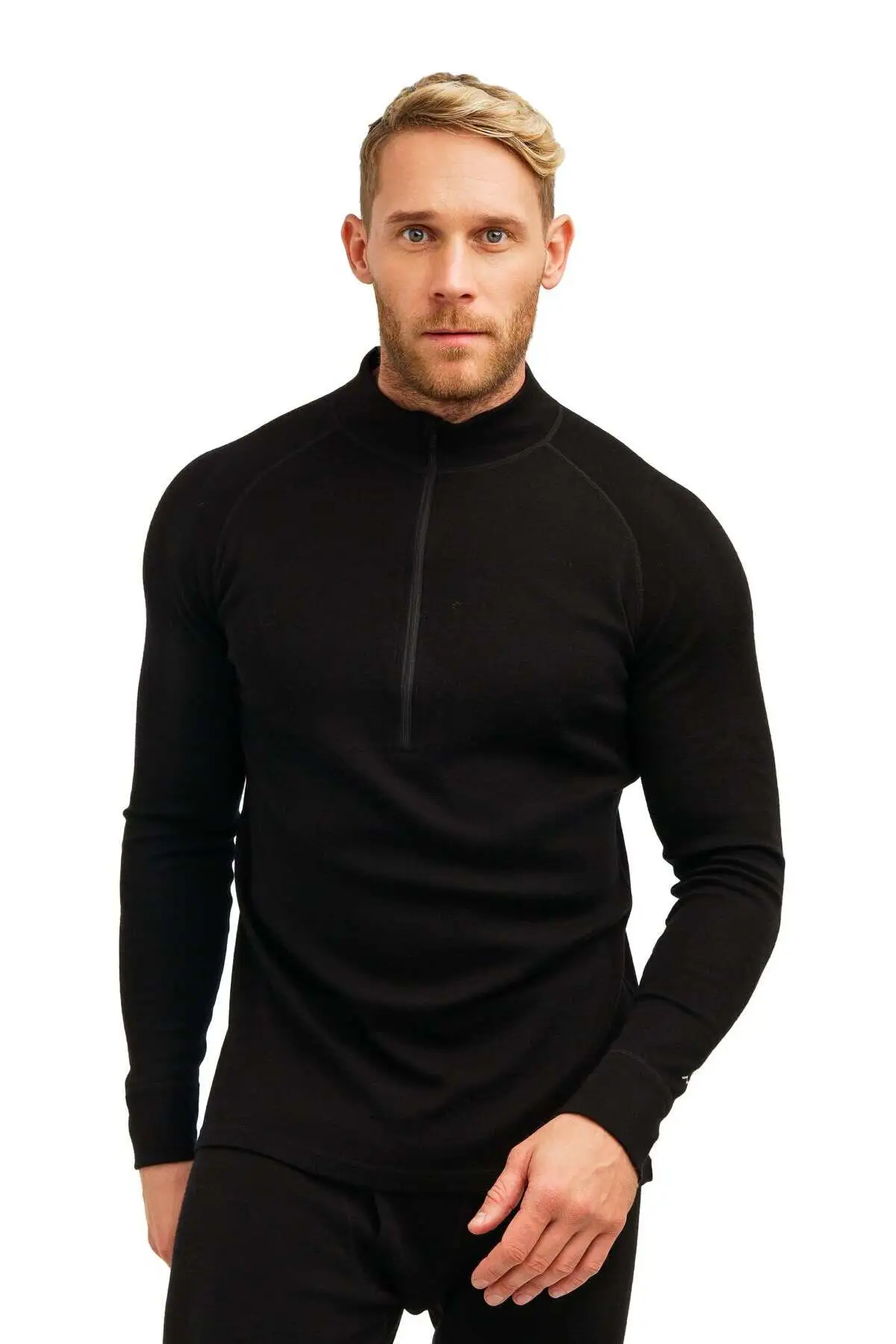 Man wearing a black merino half-zip top