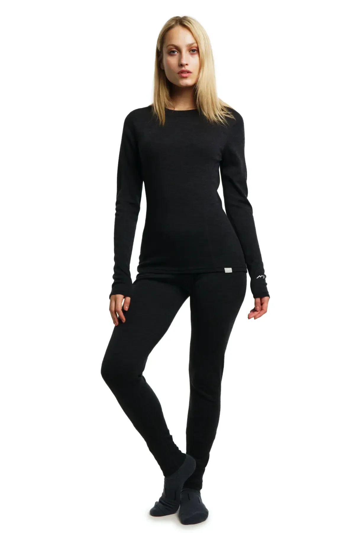 Woman modeling a charcoal long-sleeve merino top and leggings