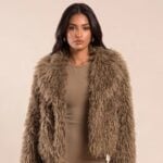 Model wearing the brown shaggy faux fur Elsie jacket