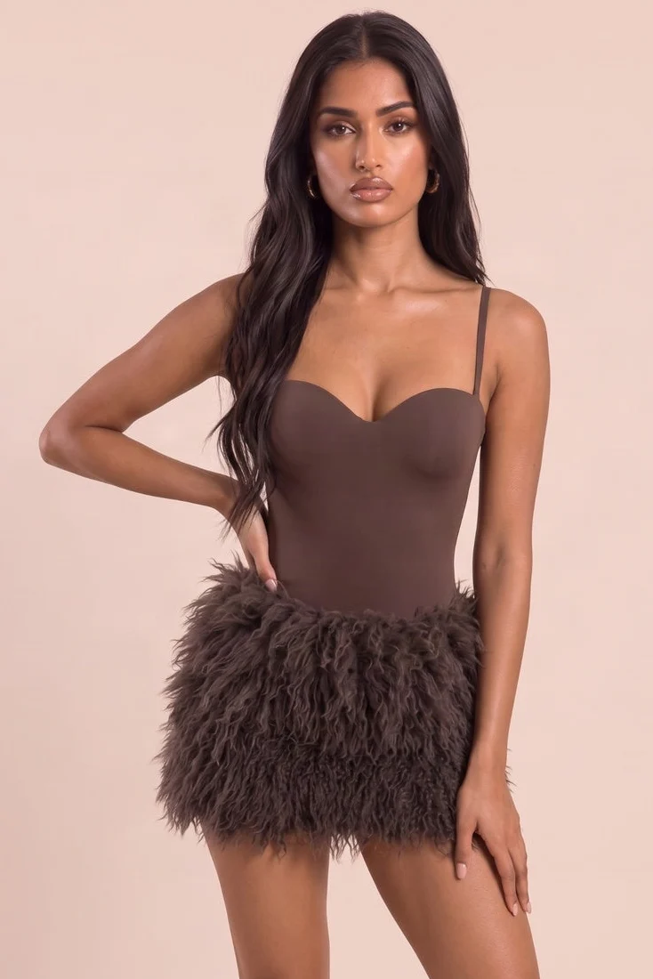 Model wearing a chocolate fluffy high-waisted mini skirt