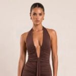 Model wearing a chocolate halterneck maxi dress