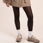 Model wearing a mocha longline puffer jacket with a faux fur trimmed hood