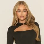 Black high neck long sleeve mini dress Preean shown on a model