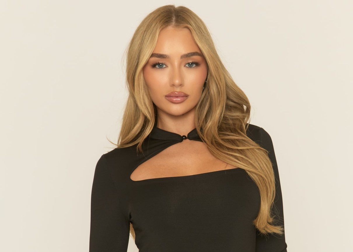 Black high neck long sleeve mini dress Preean shown on a model