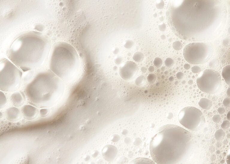 Shampoo Milk shown in a styled product scene