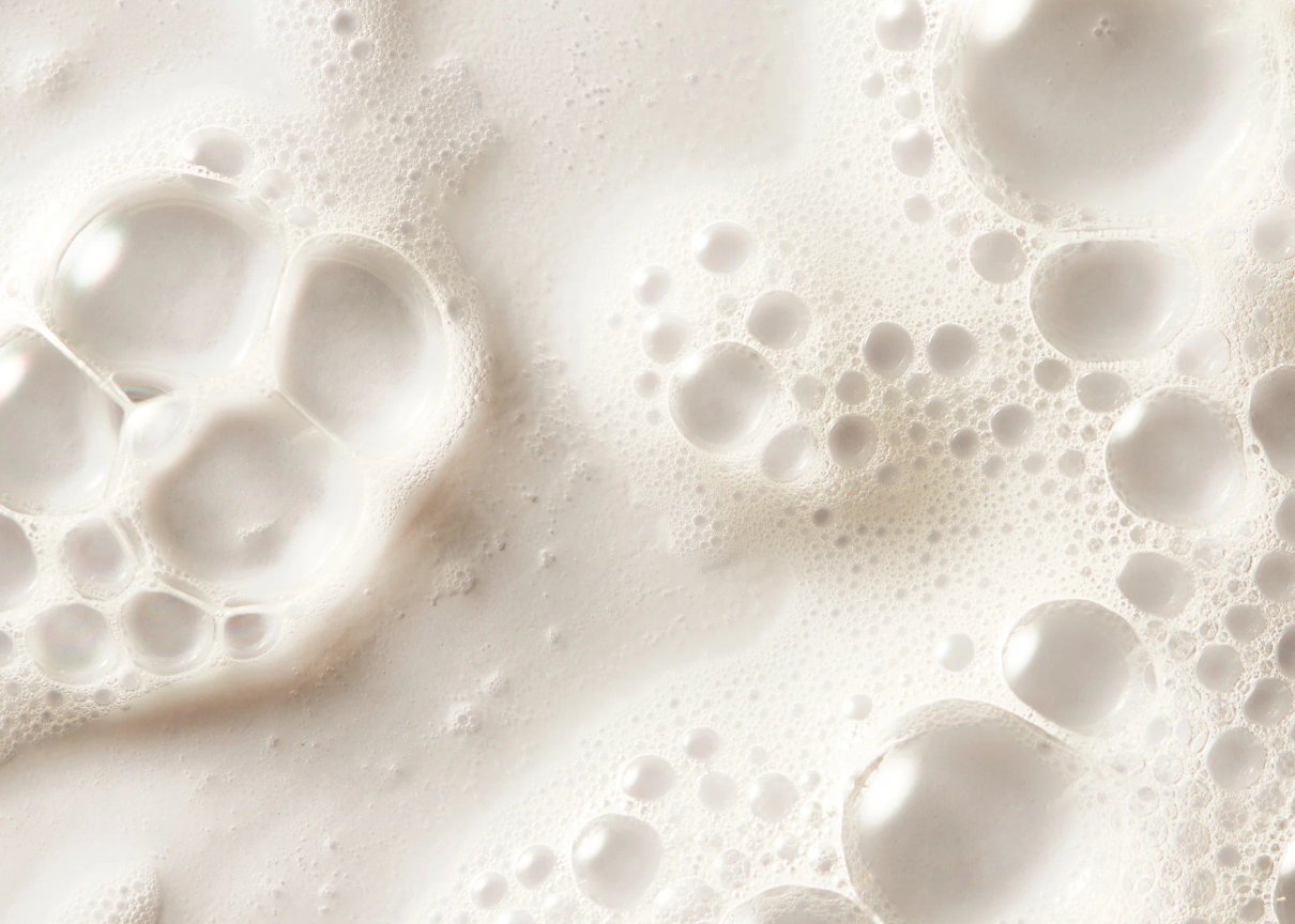 Shampoo Milk shown in a styled product scene