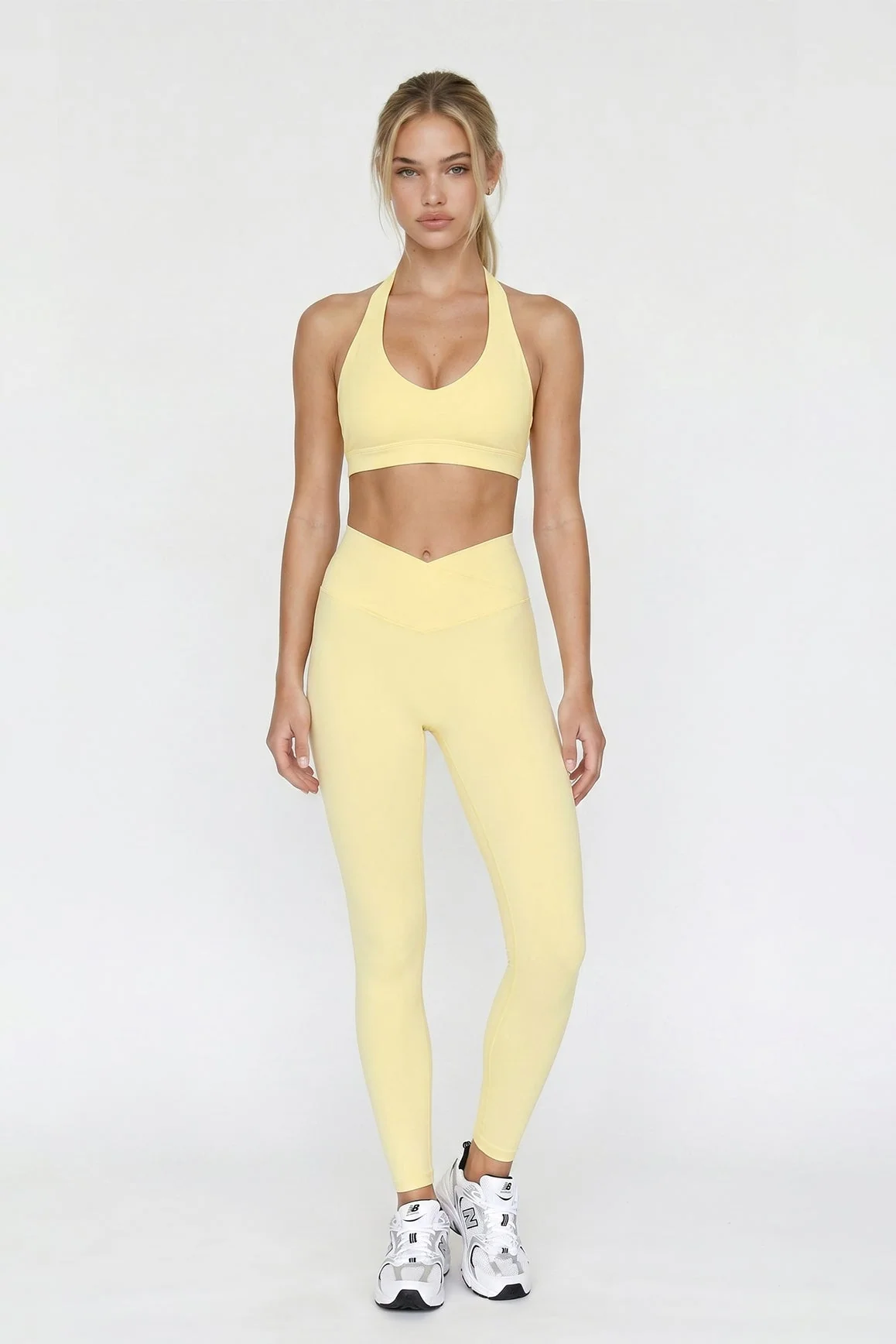 Model wearing yellow Riviera V-waist leggings