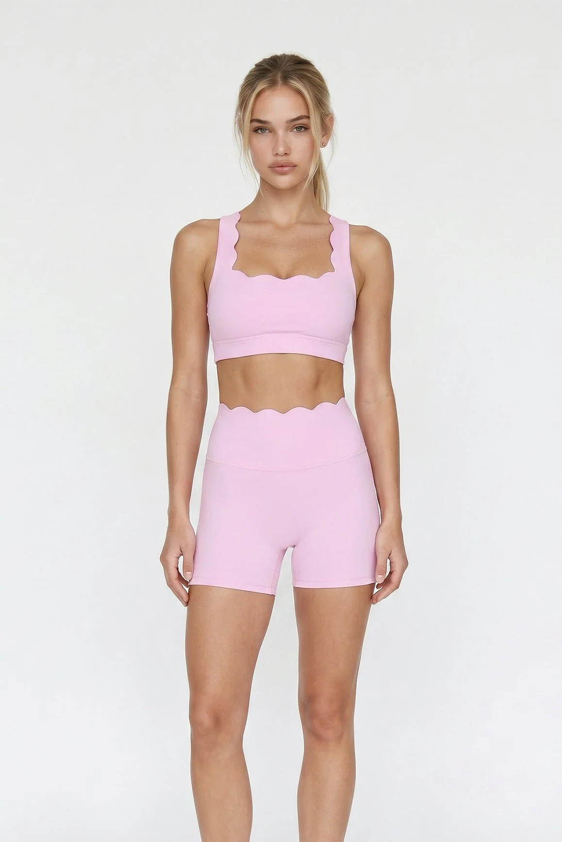 Model wearing high-waist scallop scrunch shorts