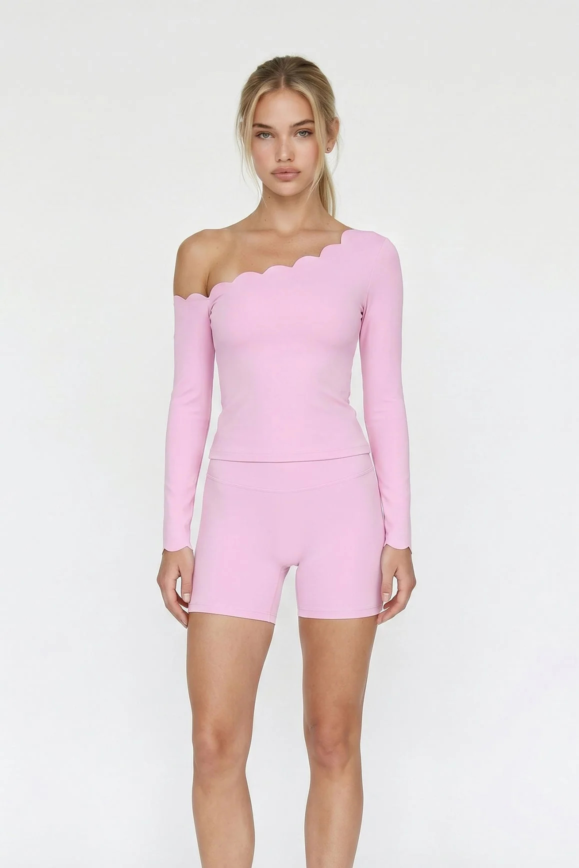 Model wearing a rose high-waist Vigor scrunch short