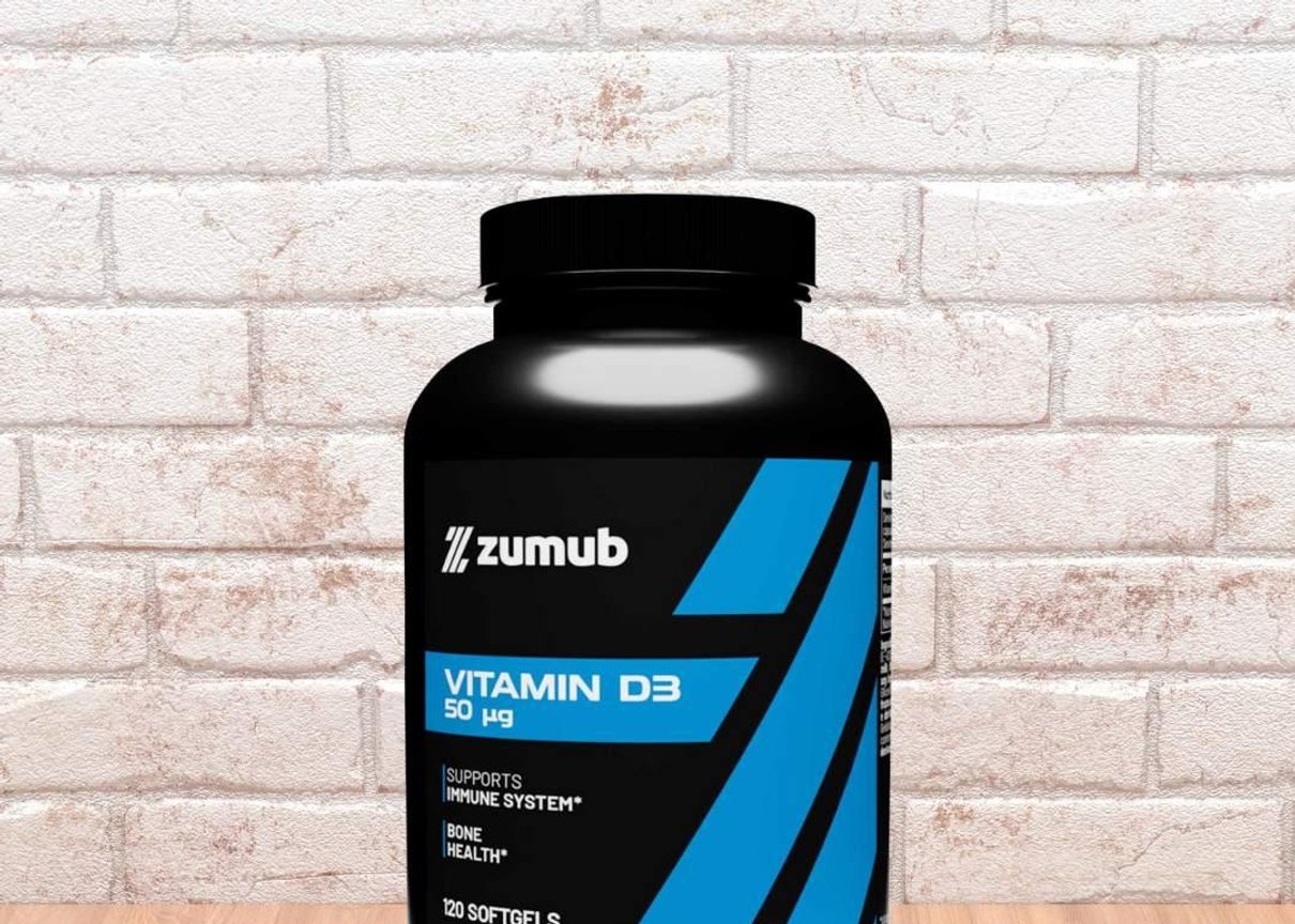Flacon de vitamine D3 Zumub posé sur une surface en bois